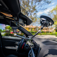 12 inch arm suction-mounted to a windshield, holding a camera inside a car