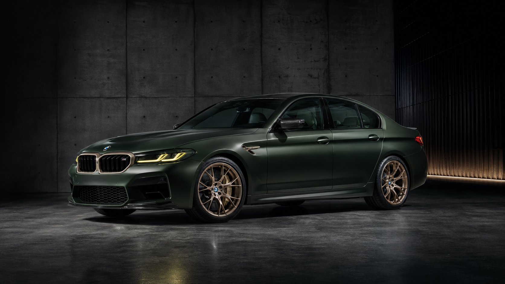 Dark green BMW M5 CS full-car studio view
